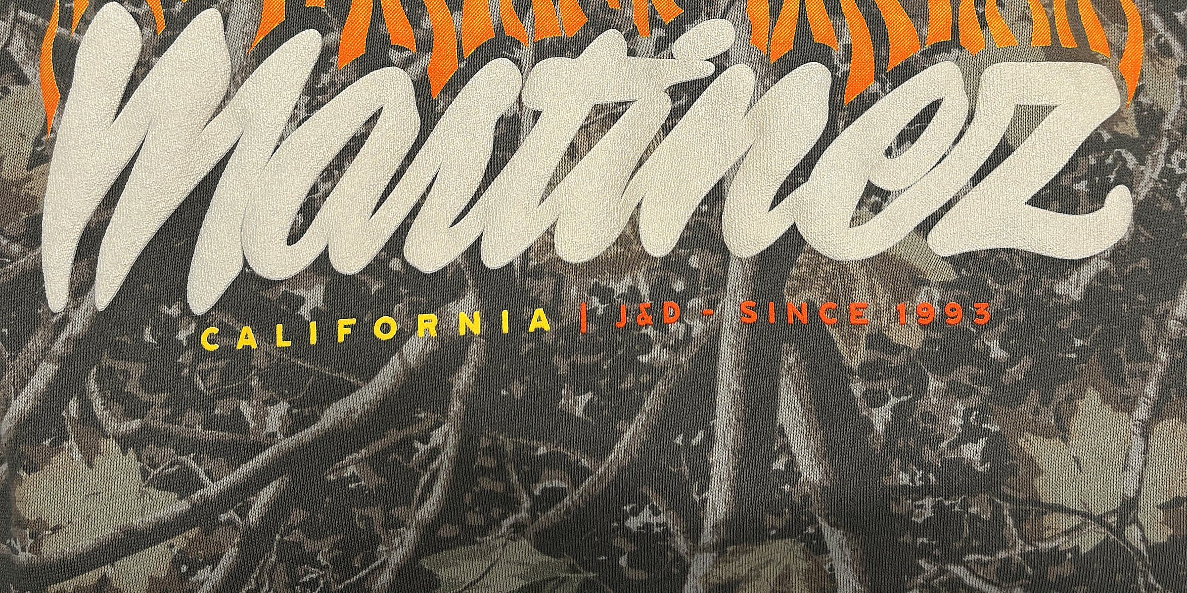 Martinez California — J&D since 1993 flames graphic on Realtree camo